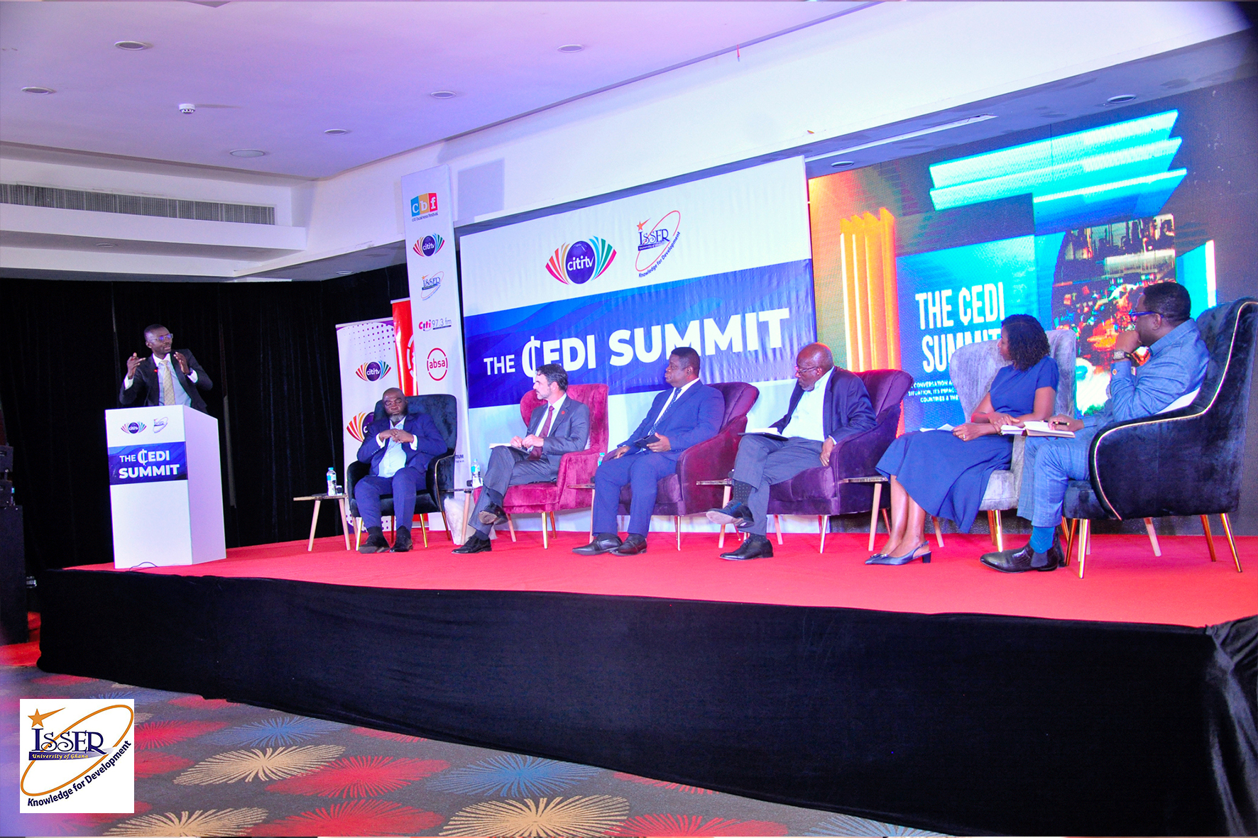 Speakers during the panel discussion (l - r): Bernard Avle (standing), David Ofosu-Dorte, Jeff Gable, Prof. Peter Quartey, Dr. Yaw Ansu, Dr. Ama Fenny, Dr. Humphrey Ayim-Darke.