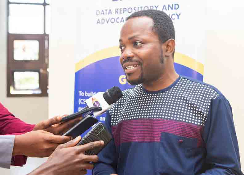 Dr. Dzanku speaks to media representatives at the event